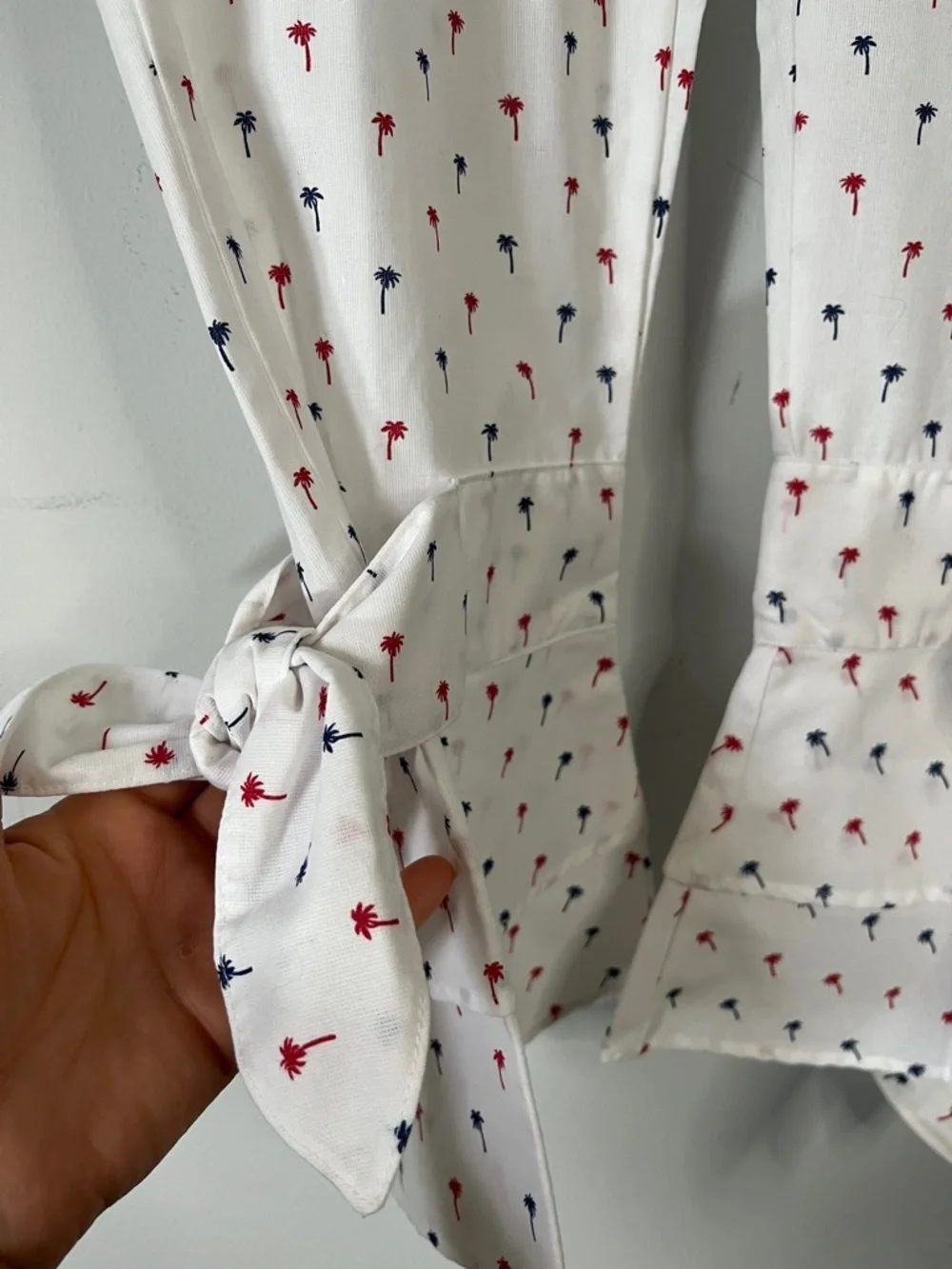 White Cropped Pants with Red & Navy Palm Print w/Ruffled Ties on each leg.  Sz L